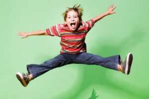 young-boy-jumping-in-midair-picture-id83266639